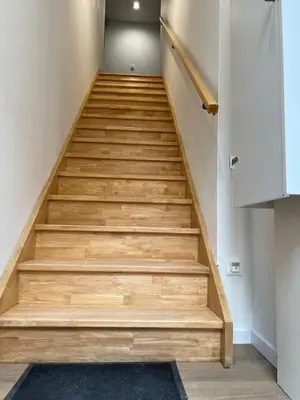 a staircase in a house with wooden steps at Le Loft du Canal du midi & son garage Vélos-Capestang in Capestang