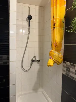 a shower with a hose and a shower head at Appartement détente dans les corbières in Conilhac-Corbières