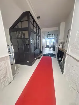 a red carpet on the floor in a living room at Day rental for Family Reunion, Anniv in Mazères