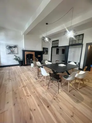 a room with a table and chairs and a fireplace at Day rental for Family Reunion, Anniv in Mazères