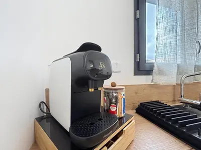a coffee maker sitting on a counter in a kitchen at La Caminade - Maison Neuve - Climatisation et Wifi in Saint-André-de-Roquelongue