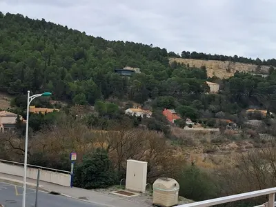 a view of a hill with houses and a street light at Villa Pierrot in Portel-des-Corbières