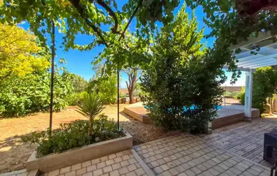 a garden with trees and a white pergola at Gorgeous Home In Villespassans in Villespassans