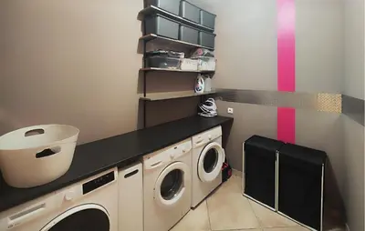 a laundry room with a washer and dryer at Stunning Home In Puisserguier in Puisserguier