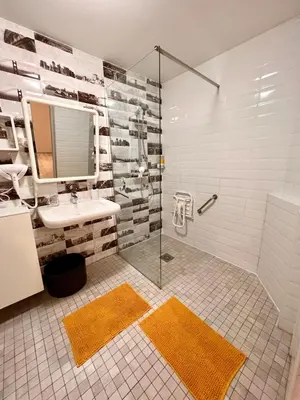 a bathroom with a sink and a shower at Loft jacuzzi à 8 min des Grands Buffets et du centre-ville in Narbonne