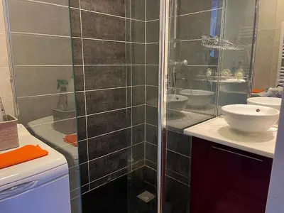 a bathroom with a glass shower and a sink at Gruissan : T2 Climat. et Parking Proche Village - FR-1-796-96 in Gruissan