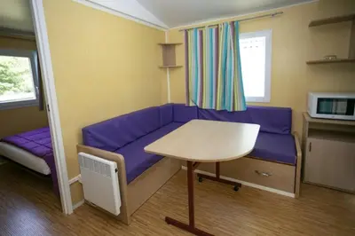 a bathroom with a sink and a glass shower door at Camping 3 étoiles - Piscine - ccbeed0 in Mazères