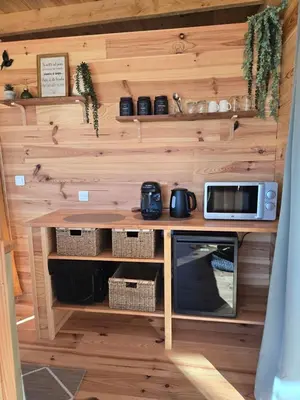 a small kitchen with a counter and a microwave at La parenthèse in Ansignan