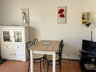 a dining room with a table and chairs at Gruissan - Villa 6 Pers - Terrasses - Secteur Calme - FR-1-796-102 in Gruissan