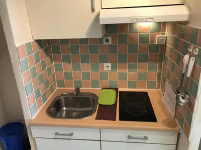 a small kitchen with a sink and a stove at Studio à 50m de la Plage du Grazel avec Parking - FR-1-796-104 in Gruissan