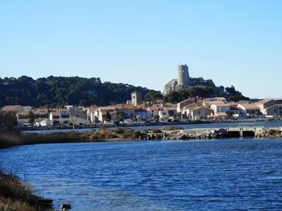 a body of water with a town in the background at Villa T4 8 pers proche plage Grazel, parking privé et terrasse - FR-1-796-98 in Gruissan