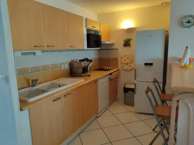 a small kitchen with a sink and a refrigerator at Villa T4 Gruissan avec Vue Mer, Climatisée, 80m2, Plage à 50m, 6 Pers. - FR-1-796-100 in Gruissan
