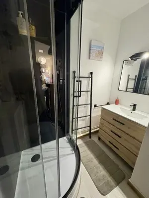 a bathroom with a shower and a sink at Studio sur le port avec piscine & terrasse in Gruissan