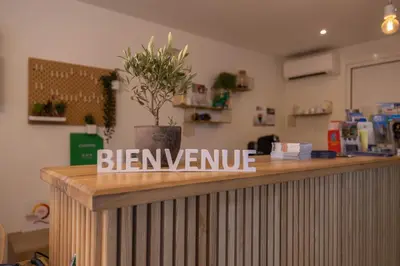 a bar with a sign that says bernvenue on it at Camping La Tour de France in Latour-de-France