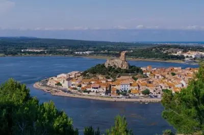 an island in the middle of a body of water at Le Petit Grazel in Gruissan