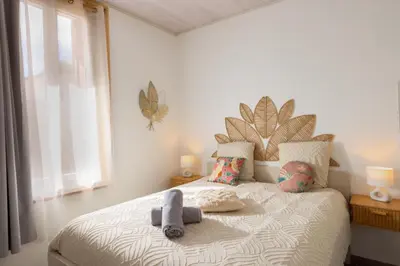 a bedroom with a bed with two stuffed animals on it at Kavi-T3 Cozy - Medieval City 4 min - Air-Conditioning-Parking in Carcassonne