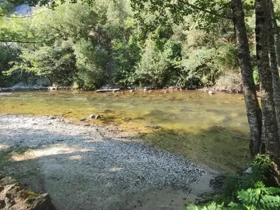 a river with trees and rocks in the water at Mobil-home 6 Pers avec Terrasse à Axat - API-1-52-973 in Axat