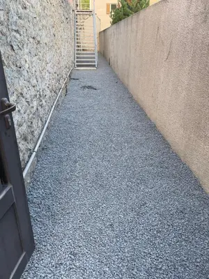 a hallway with a stairway leading to a building at MCC House, cozy accommodation with terrace and BBQ in Quillan