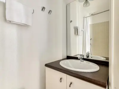 a bathroom with a sink and a mirror at P Minervois J N07 Villa 3P4 in Homps