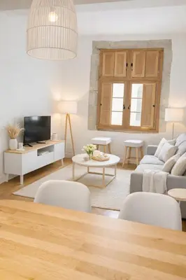 a living room with a couch and a table at Magnifique T2 - à 5 min de la Cité Médiévale in Carcassonne