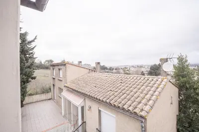 a view of a house with a roof at Terrasse et parking a 500m de la Cite AR in Carcassonne