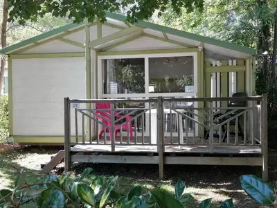 a house with a pink chair on a porch at Chalet familial 5 pers avec terrasse à Axat - API-1-52-1152 in Axat