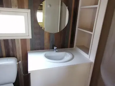a bathroom with a white sink and a mirror at Chalet familial 5 pers avec terrasse à Axat - API-1-52-1152 in Axat