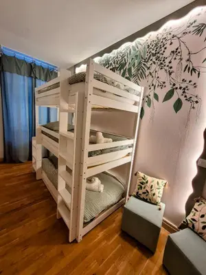 a bedroom with two bunk beds in a room at Le Damier in Castres