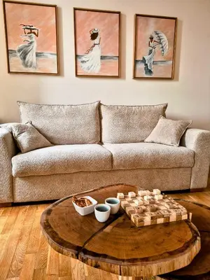 a living room with a couch and a table at Le Damier in Castres