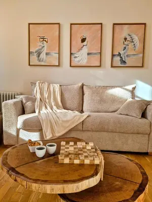 a living room with a couch and a table at Le Damier in Castres