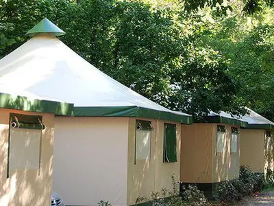 a small white building with a green roof at Bungalow toilé avec terrasse jusqu'à 5 personnes - API-1-52-1480 in Axat