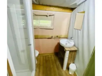 a small bathroom with a sink and a toilet at Lodge 22m² avec Terrasse - Pour 5 Personnes - API-1-52-1500 in Camon