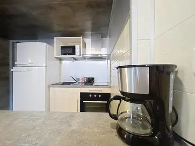a kitchen with a blender on top of a counter at Le Vicomte - Appartement en Duplex - Centre ville in Narbonne
