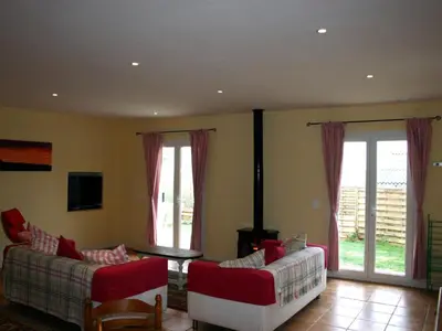 a living room with two couches and a tv at Holiday Home Haus für 6 Personen und 8 Kinder in Villautou by Interhome in Villautou