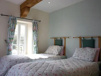 two beds in a bedroom with a window at Holiday Home für 2 Personen und 2 Kinder by Interhome in Villautou