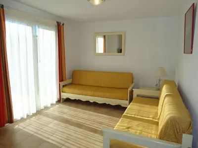 a living room with a couch and a window at Holiday Home VILLA T3 PMR ZWISCHEN NARBONNE UND CARCASSONNE by Interhome in Homps