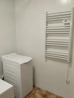 a white bathroom with a toilet and a shower at Cheminée, jardin et tranquillité assurée in Verdalle