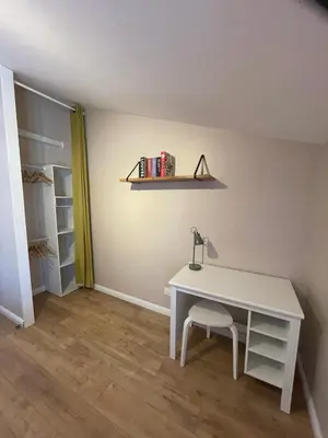 a white desk with a lamp and a chair in a room at Gîte Le Courredou Portel des Corbières in Portel-des-Corbières