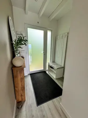 an empty hallway with a door and a plant at Le Havre de Paix in Espérausses
