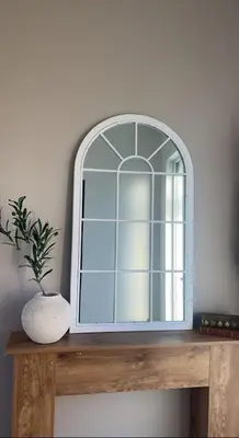 a mirror on top of a wooden table with a plant at Le Havre de Paix in Espérausses