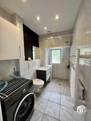 a bathroom with a stove and a toilet and a sink at La calm in Villardonnel