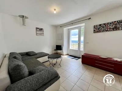 a living room with a couch and a table at La calm in Villardonnel