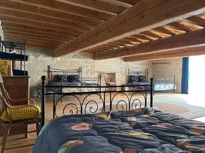 a bedroom with two beds in a room at Soupex Castle century XII in Soupex