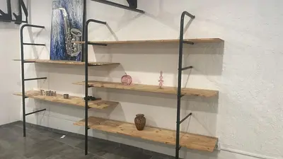 a room with wooden shelves on a wall at Résidence des catalans in Narbonne