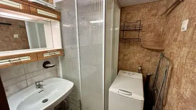 a small bathroom with a sink and a toilet at Pavillon avec piscine collective proche Grazel - GN020-001 in Gruissan