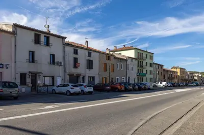 a street with cars parked on the side of the road at Duplex cosy à Mirepoix centre, tout confort in Mirepoix