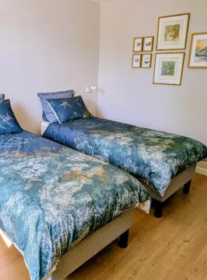 two beds sitting next to each other in a room at Domaine de Grave in Mirepoix