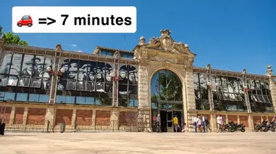 a large building with people standing outside of it at T2 lumineux avec parking privé in Narbonne