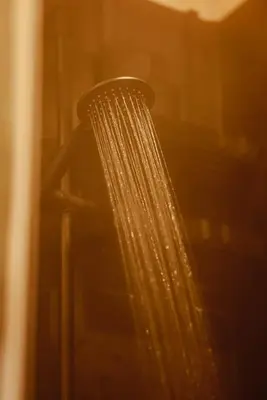 a shower head with droplets of water on it at Homnest - Brumes des Hauts Bains - Coeur Pyrennees in Escouloubre
