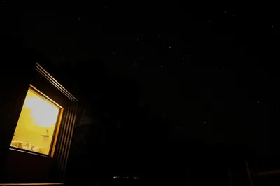 a window in a wall with a light in it at Homnest - Brumes des Hauts Bains - Coeur Pyrennees in Escouloubre